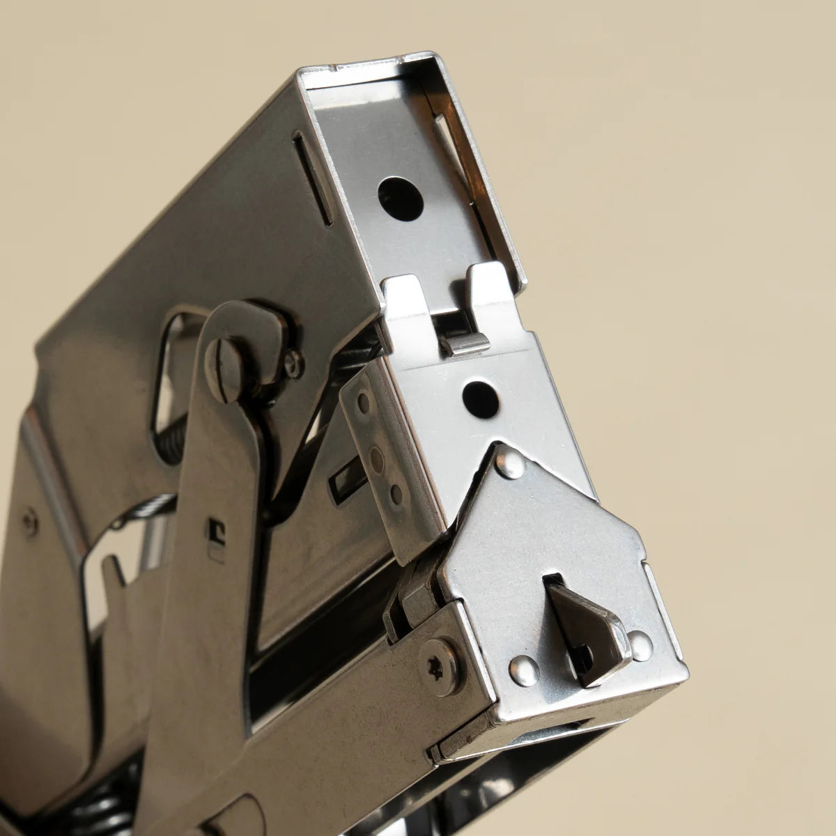 Portable and compact corner nail gun