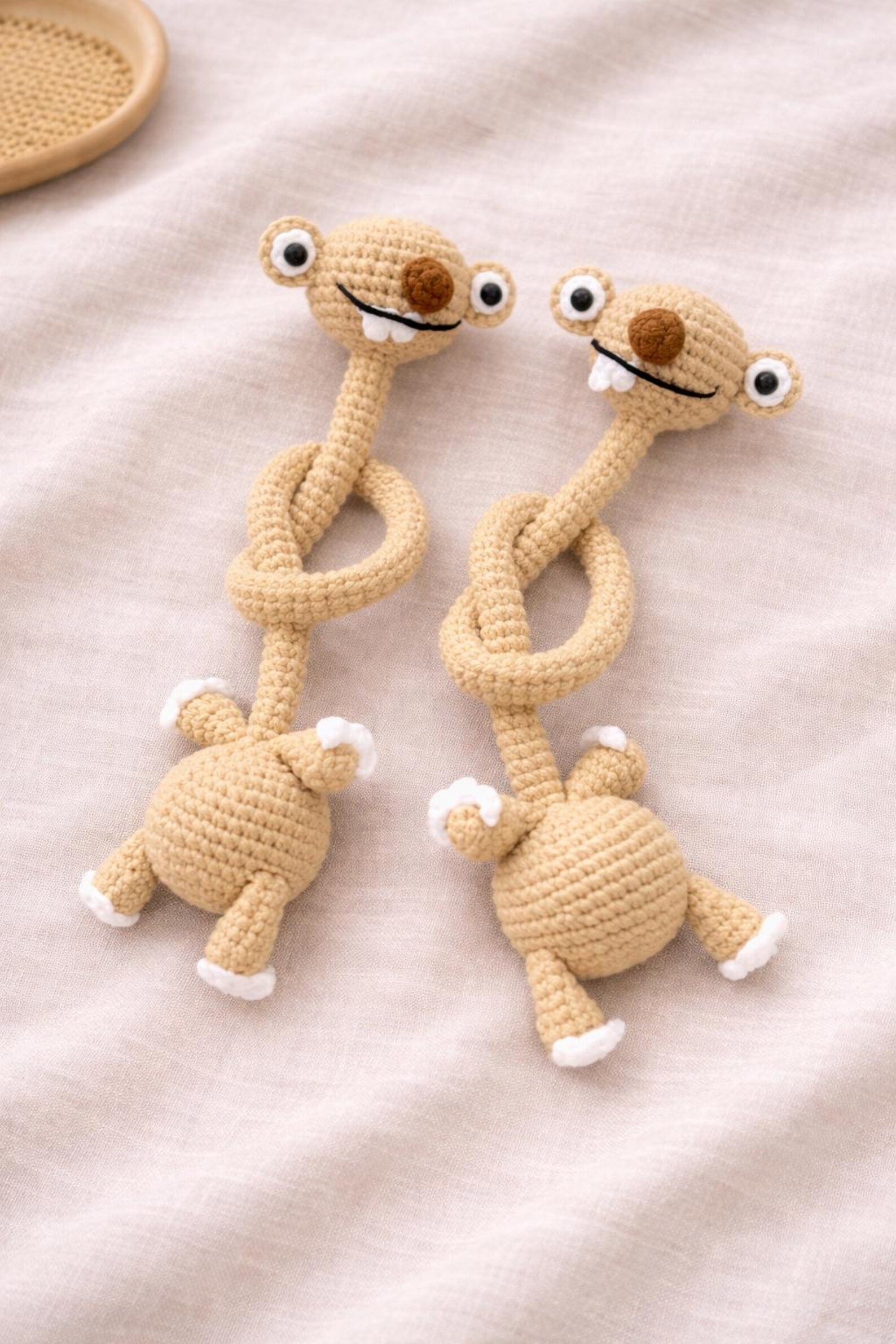 Hand-Crocheted Prehistoric Sloth Charm — A quirky, long-necked plush buddy, crafted to delight any animal lover
