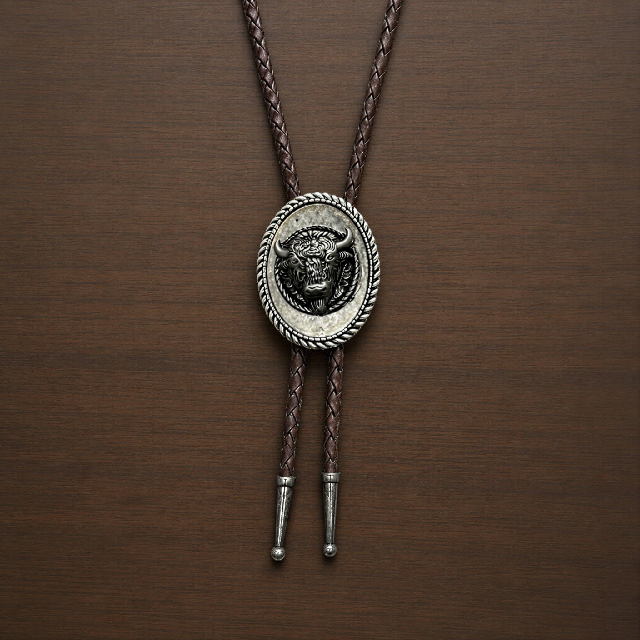 mesathread-antique-silver-bison-head-oval-western-bolo-tie-dark-brown-braided-cord-front-view
