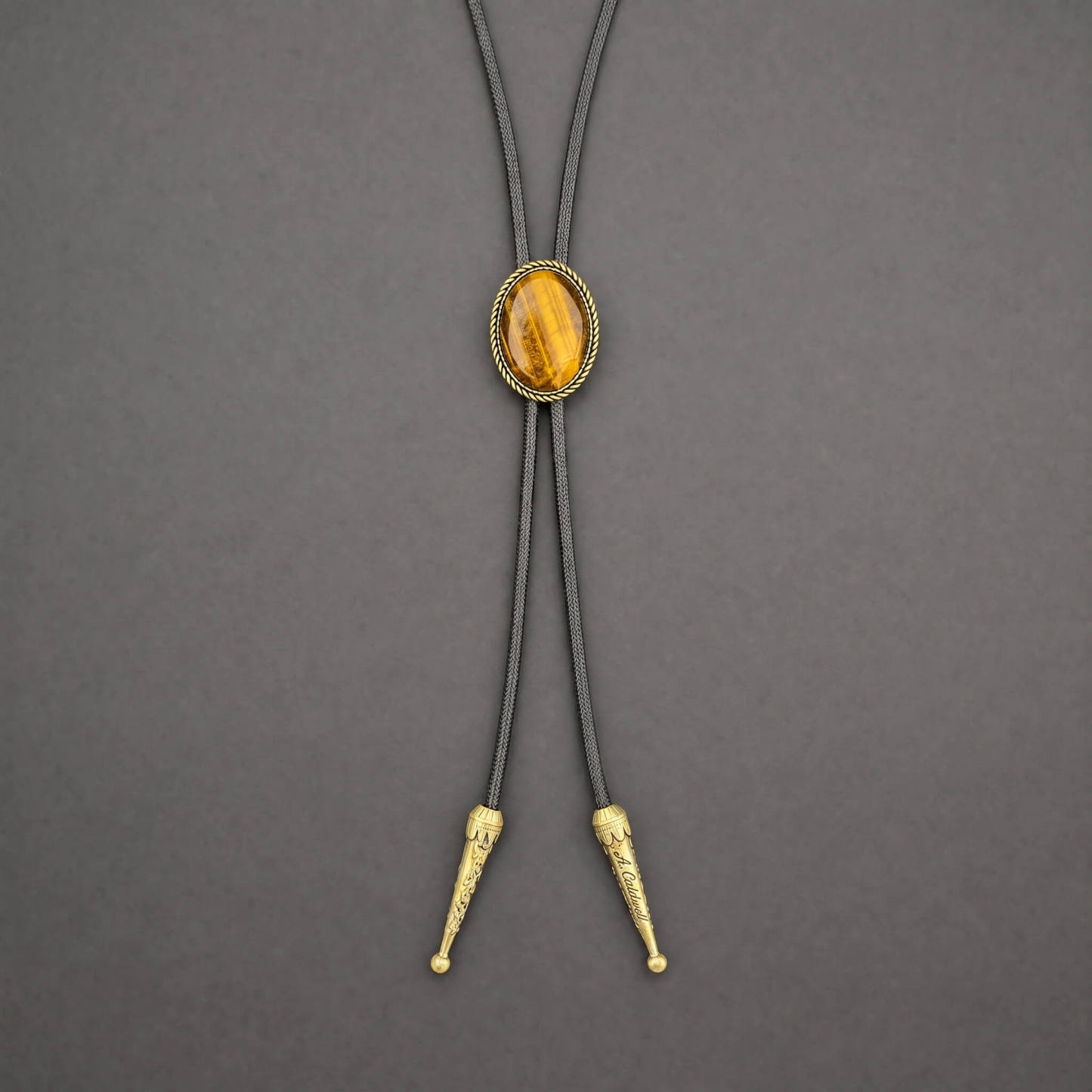 sierracrest-oval-golden-tigers-eye-brass-rope-western-bolo-tie-ornament-slide-front-view