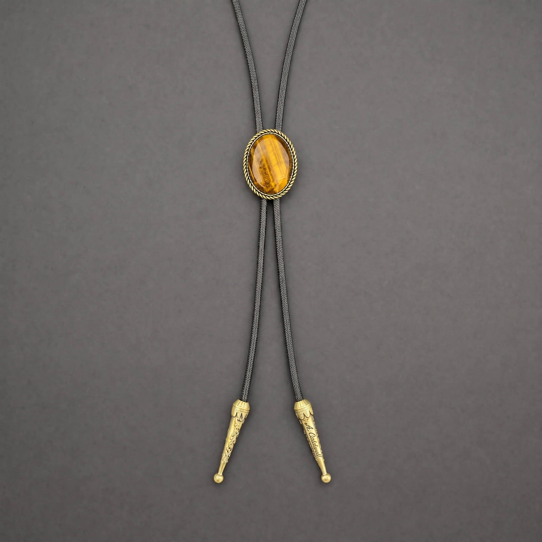 sierracrest-oval-golden-tigers-eye-brass-rope-western-bolo-tie-ornament-slide-front-view