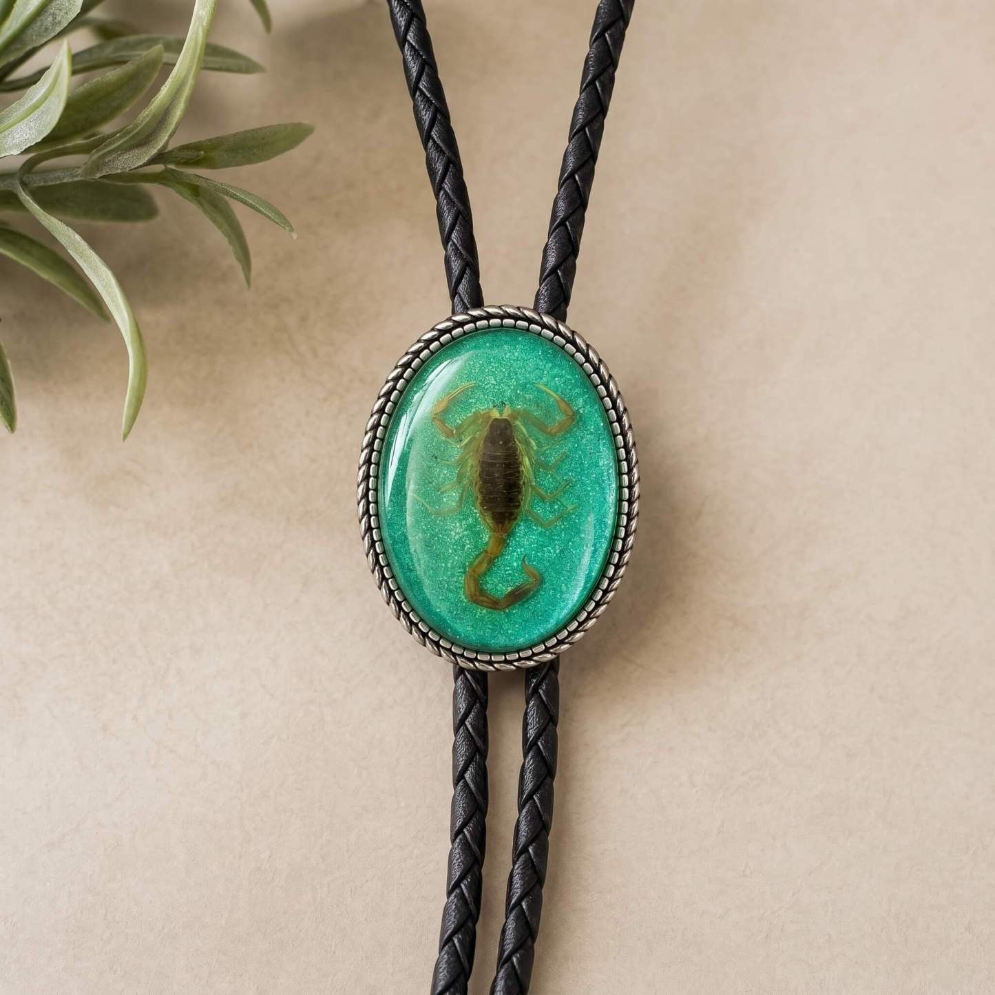 curiocraft-luminous-emerald-scorpion-lucite-oval-western-bolo-tie-ornament-slide-front-view