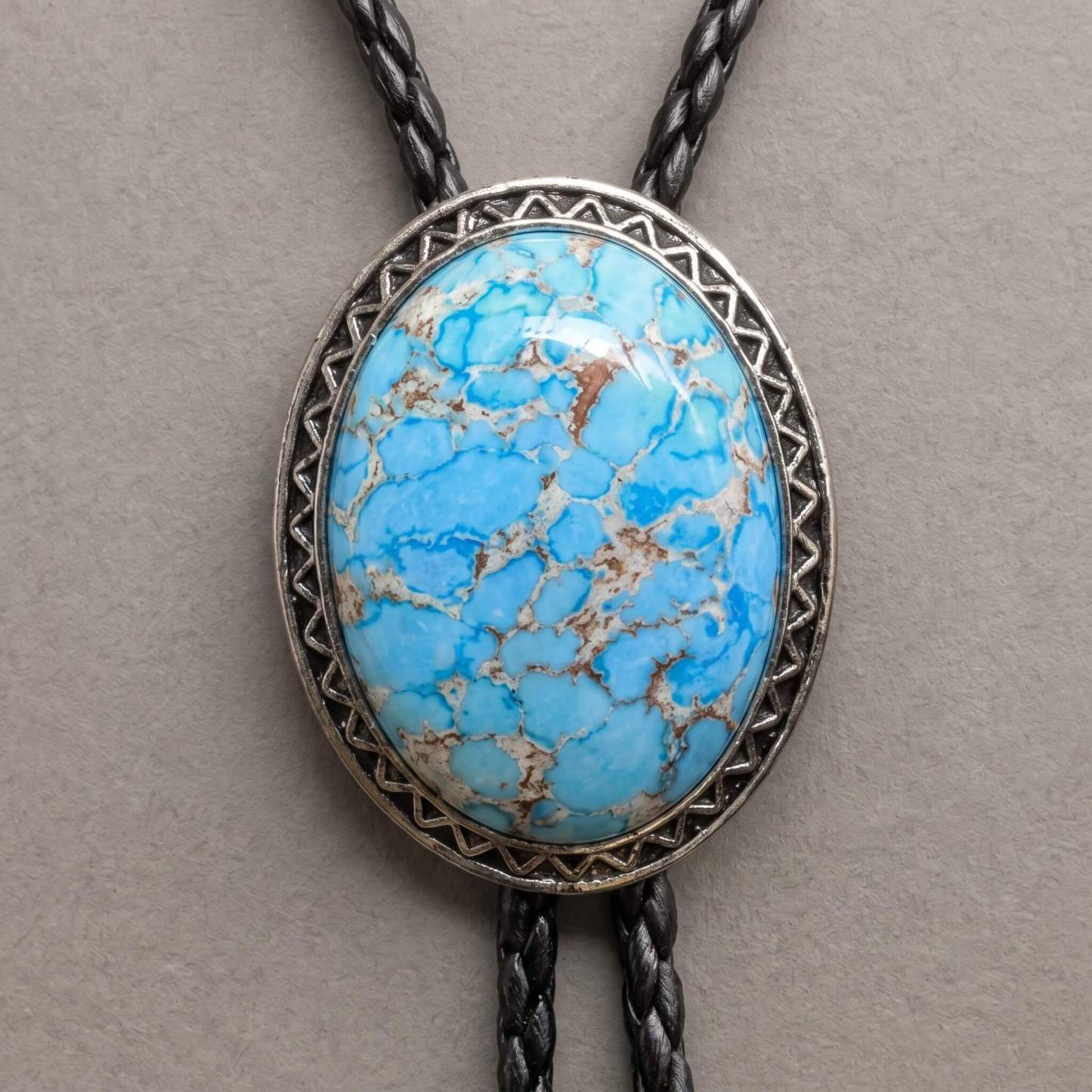 sierracrest-oval-sky-blue-matrix-pattern-chevron-border-western-bolo-tie-ornament-slide-front-view