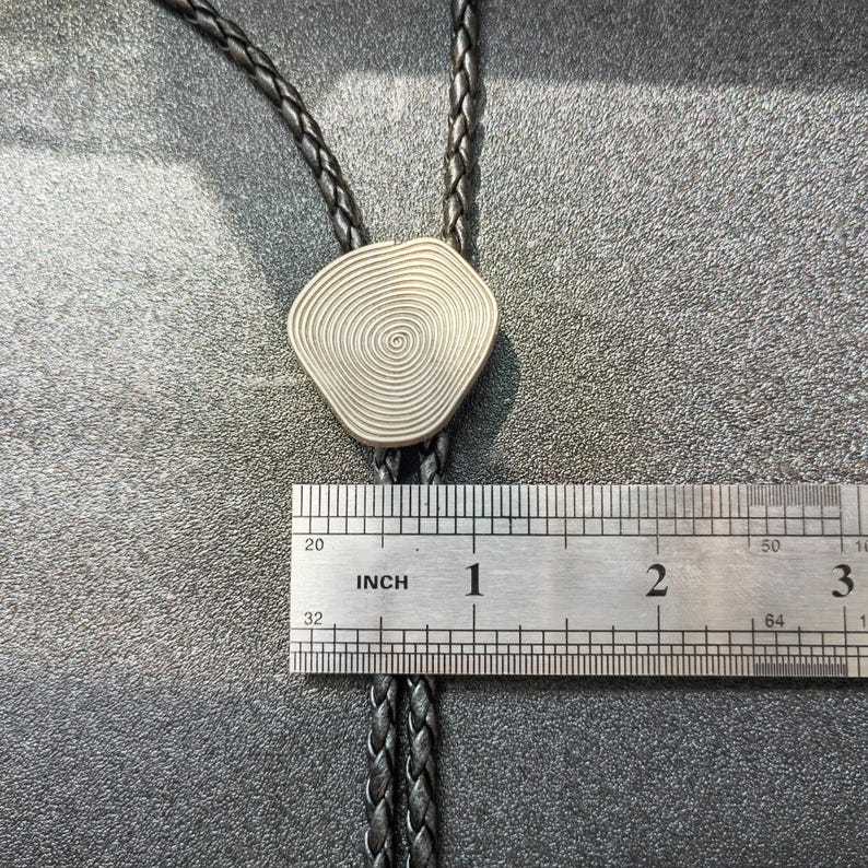 Metal Annual Bolo Tie-MesaThread