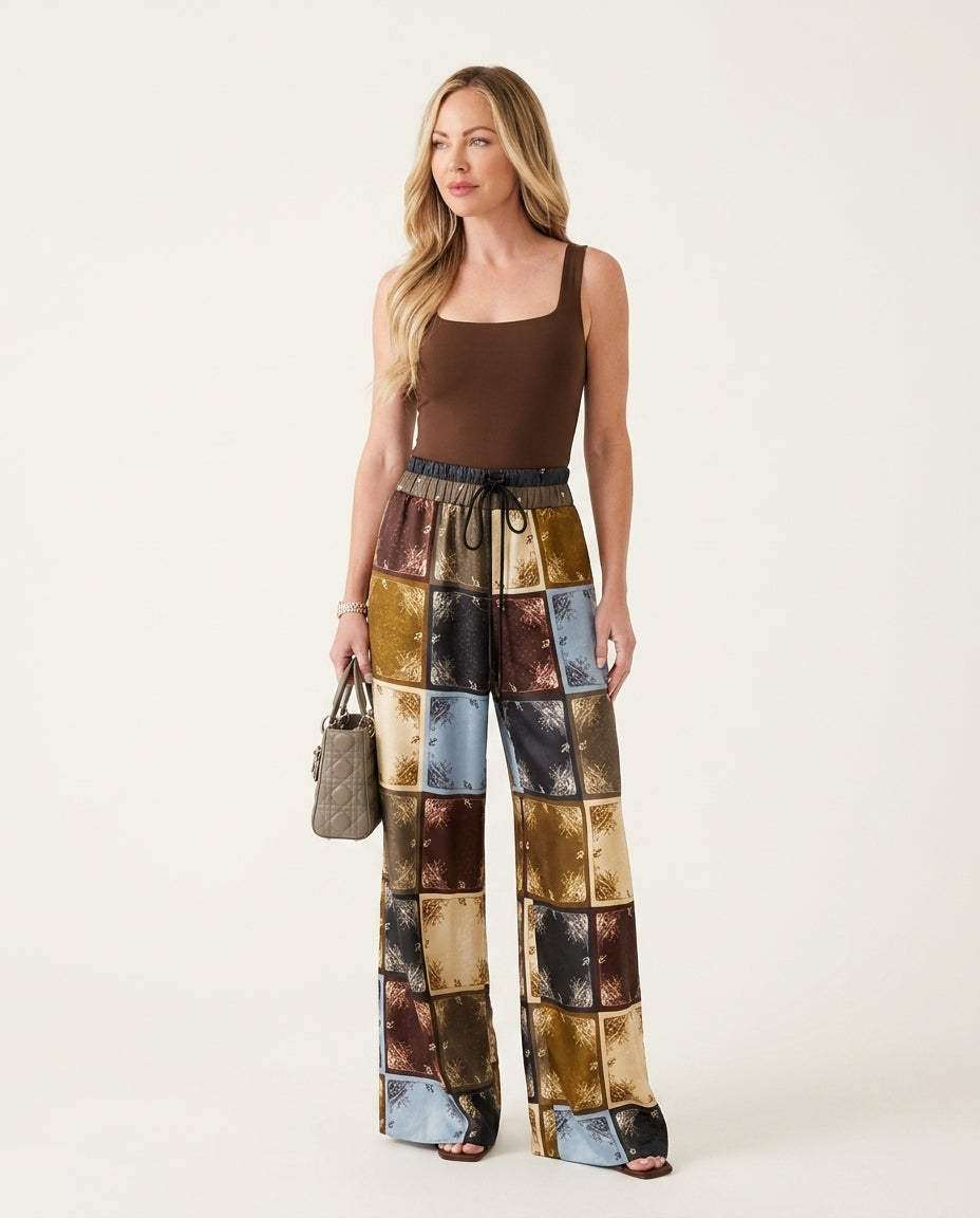 Brown Aura Resort Printed Pants Brown Pants with Wide-Leg silhouette and Satin texture, clean studio product view for Resort Wear, a rooftop dinner in LA, US Coastal Glam by Massicos