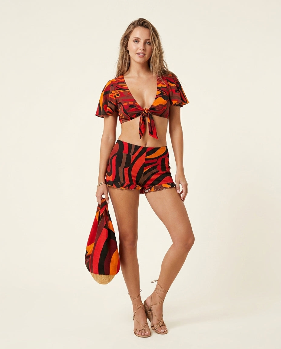 Red Charm Resort Abstract Print Romper Red Romper with Cropped silhouette and Textured texture, clean studio product view for Resort Wear, a London dinner reservation, Euro Chic Premium by Massicos