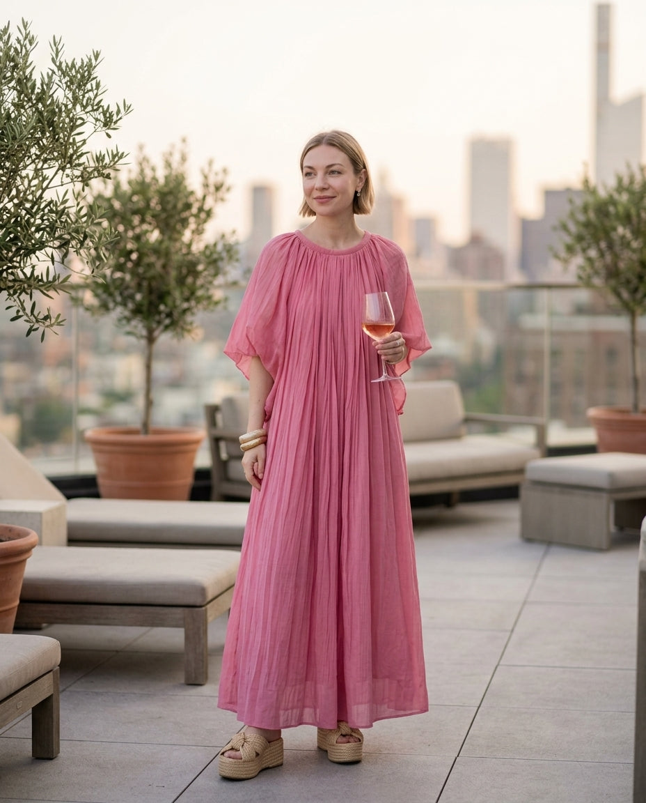 Pink Bloom Summer Pleated Maxi Dress Pink Maxi Dress with Asymmetric silhouette and Textured texture, lifestyle scene image for Wedding Guest, a private garden lunch, US East / Hamptons Elite by Massicos