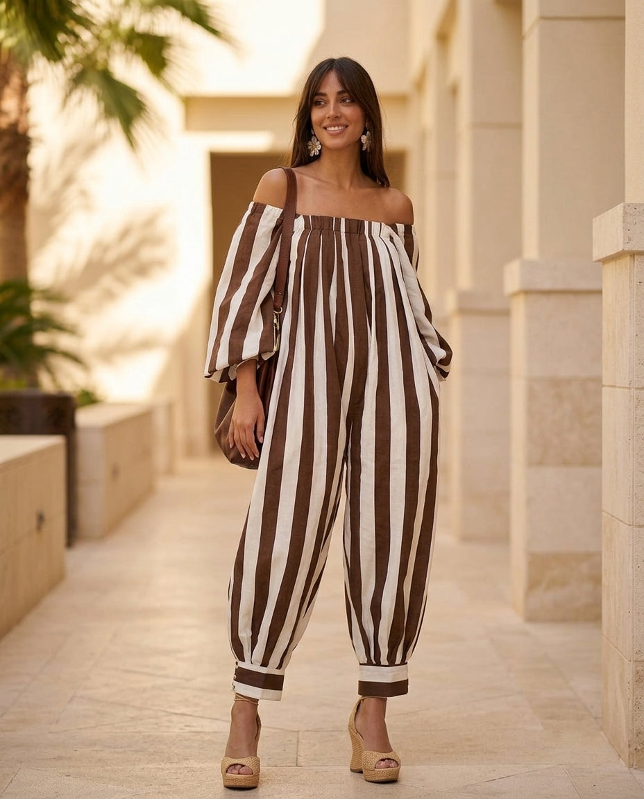 Brown Aura Resort Striped Jumpsuit Brown Jumpsuit with Wide-Leg silhouette and Linen Blend texture, lifestyle scene image for Resort Wear, a private garden lunch, US East / Hamptons Elite by Massicos