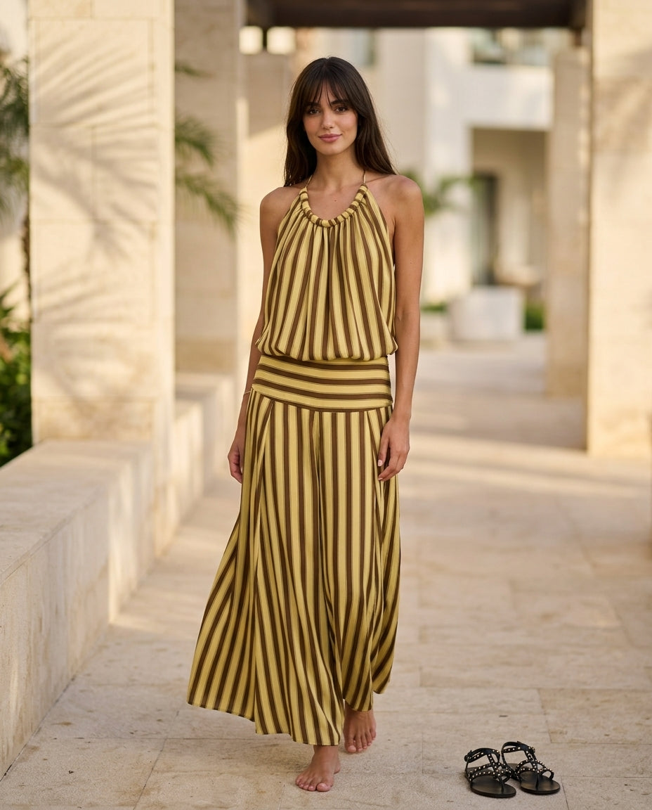 Butter Yellow Charm Resort Striped Romper Butter Yellow Romper with Relaxed Fit silhouette and Textured texture, lifestyle scene image for Resort Wear, an estate dinner at golden hour, US East / Hamptons Elite by Massicos