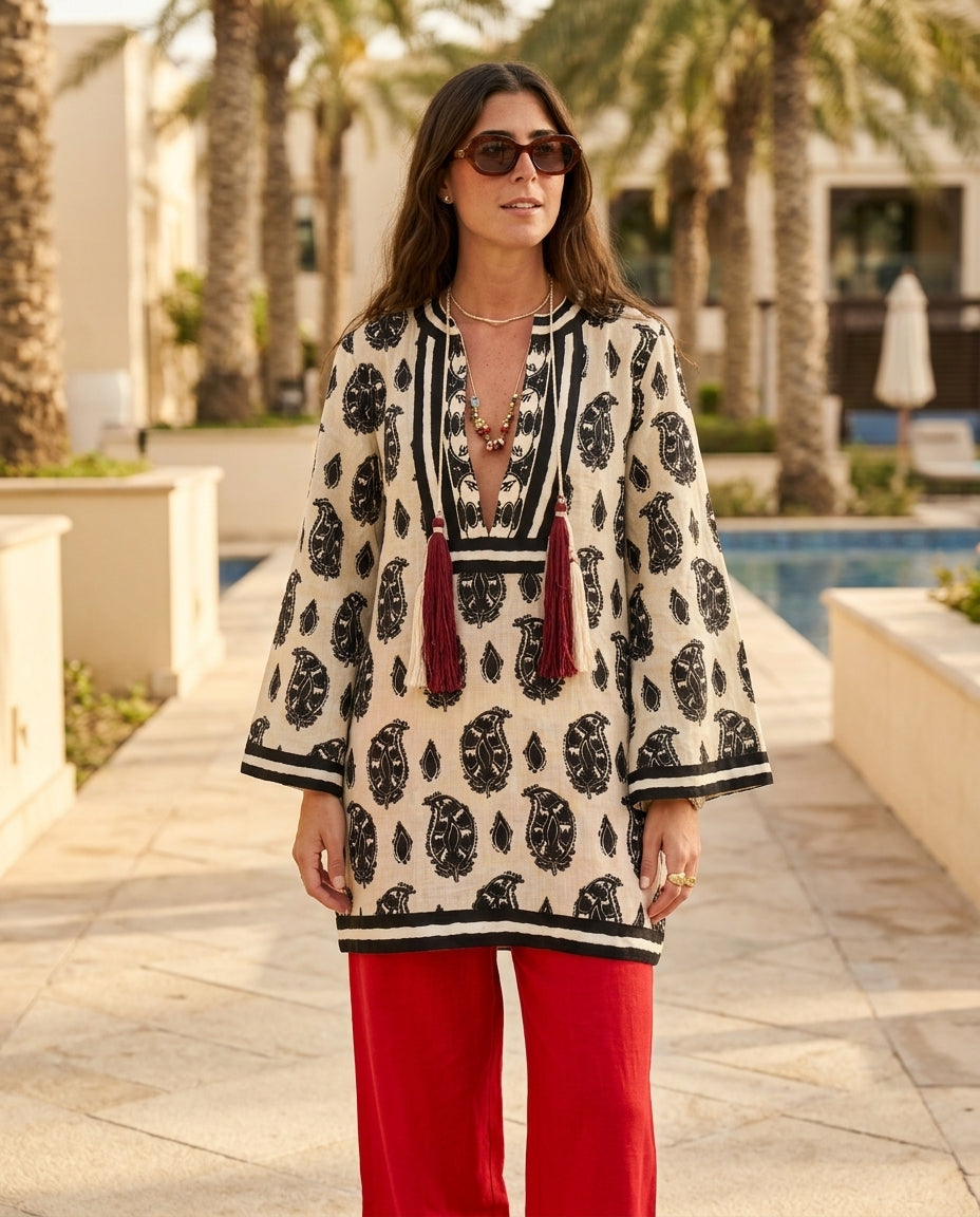 Sand Whisper Resort Paisley Maxi Dress Sand Maxi Dress with Asymmetric silhouette and Linen Blend texture, lifestyle scene image for Resort Wear, a gallery opening in Paris, Euro Chic Premium by Massicos