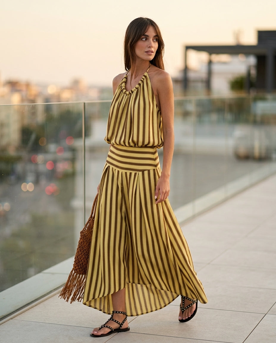 Butter Yellow Charm Resort Striped Romper Butter Yellow Romper with Relaxed Fit silhouette and Textured texture, outdoor styling image for Resort Wear, an estate dinner at golden hour, US East / Hamptons Elite by Massicos