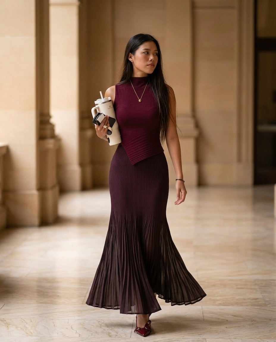 Burgundy Poise Summer Pleated Maxi Dress Burgundy Maxi Dress with Asymmetric silhouette and Ribbed Knit texture, editorial ecommerce scene for Resort Dinner, a private garden lunch, US East / Hamptons Elite by Massicos
