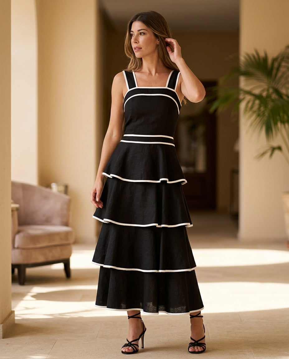 Black Aura Resort Tiered Romper Black Romper with Structured silhouette and Textured texture, editorial ecommerce scene for Resort Wear, a Palm Springs weekend, US Coastal Glam by Massicos