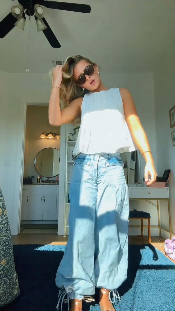 White ruffled top and light-colored loose-fitting jeans set