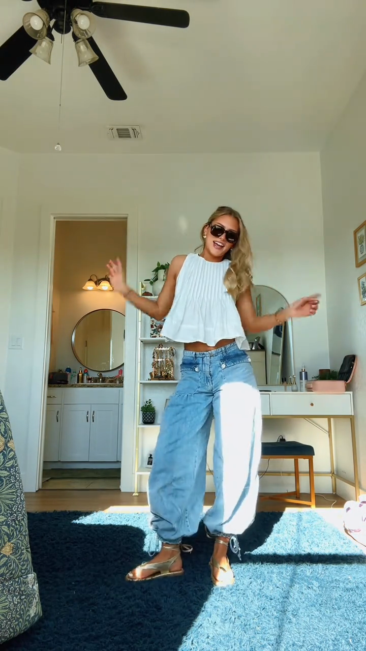 White ruffled top and light-colored loose-fitting jeans set