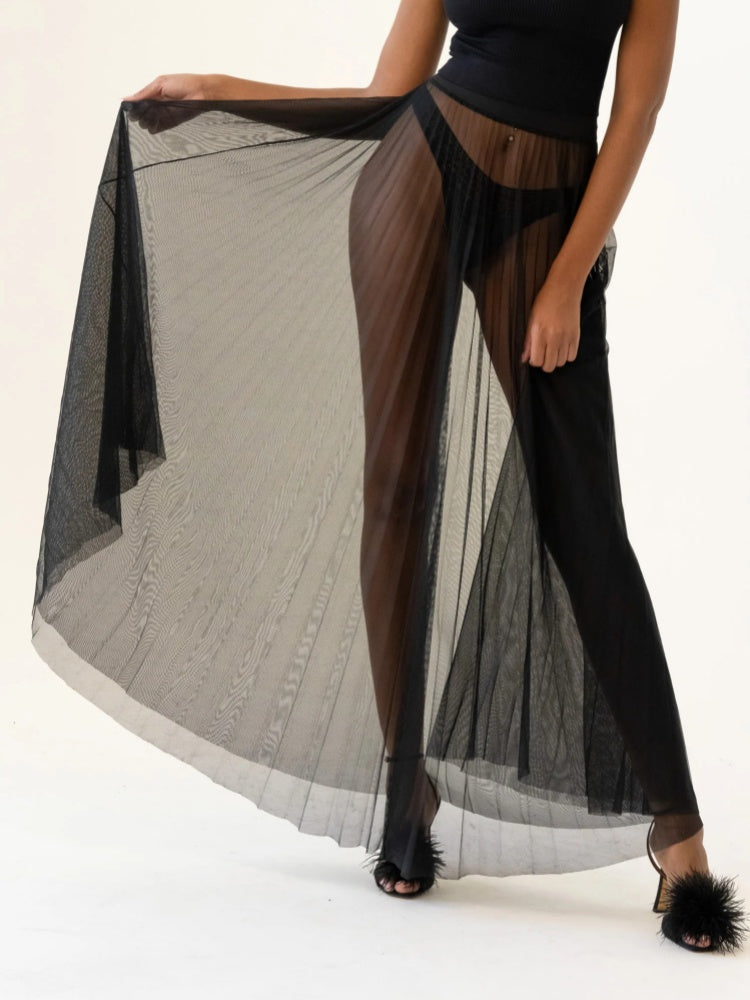 Black oversized turtleneck sweater and sheer long skirt set