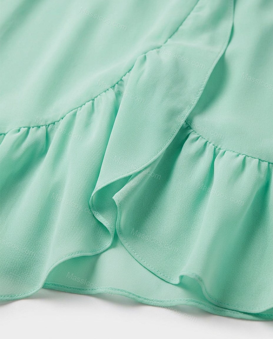 Mint Green Strapless Ruffled Peplum Dress, close-up of peplum waist, tiered skirt and ruffle trim, by Massicos
