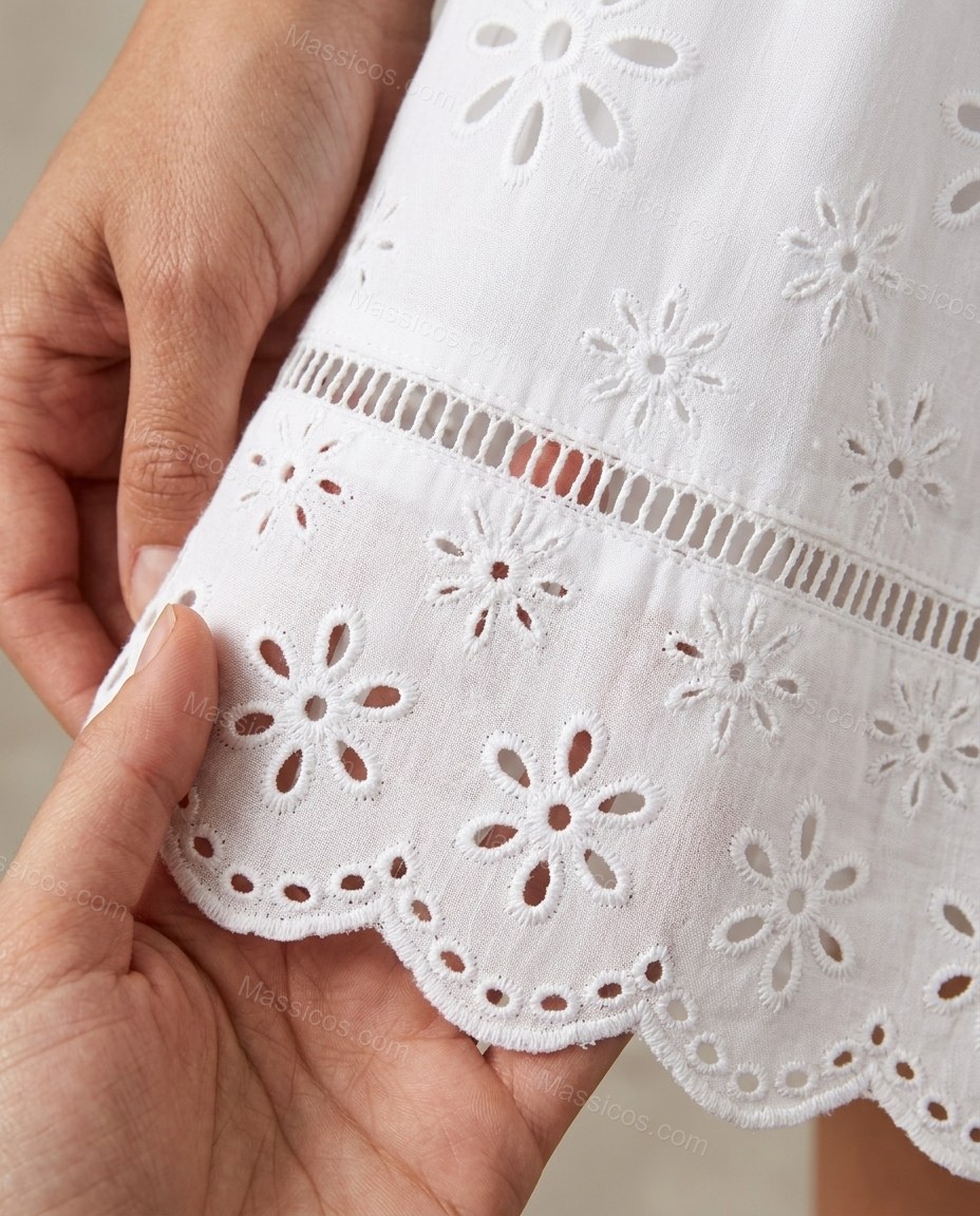 White Floral Ladder-Strap Eyelet Dress, close-up of floral and eyelet cutwork, by Massicos