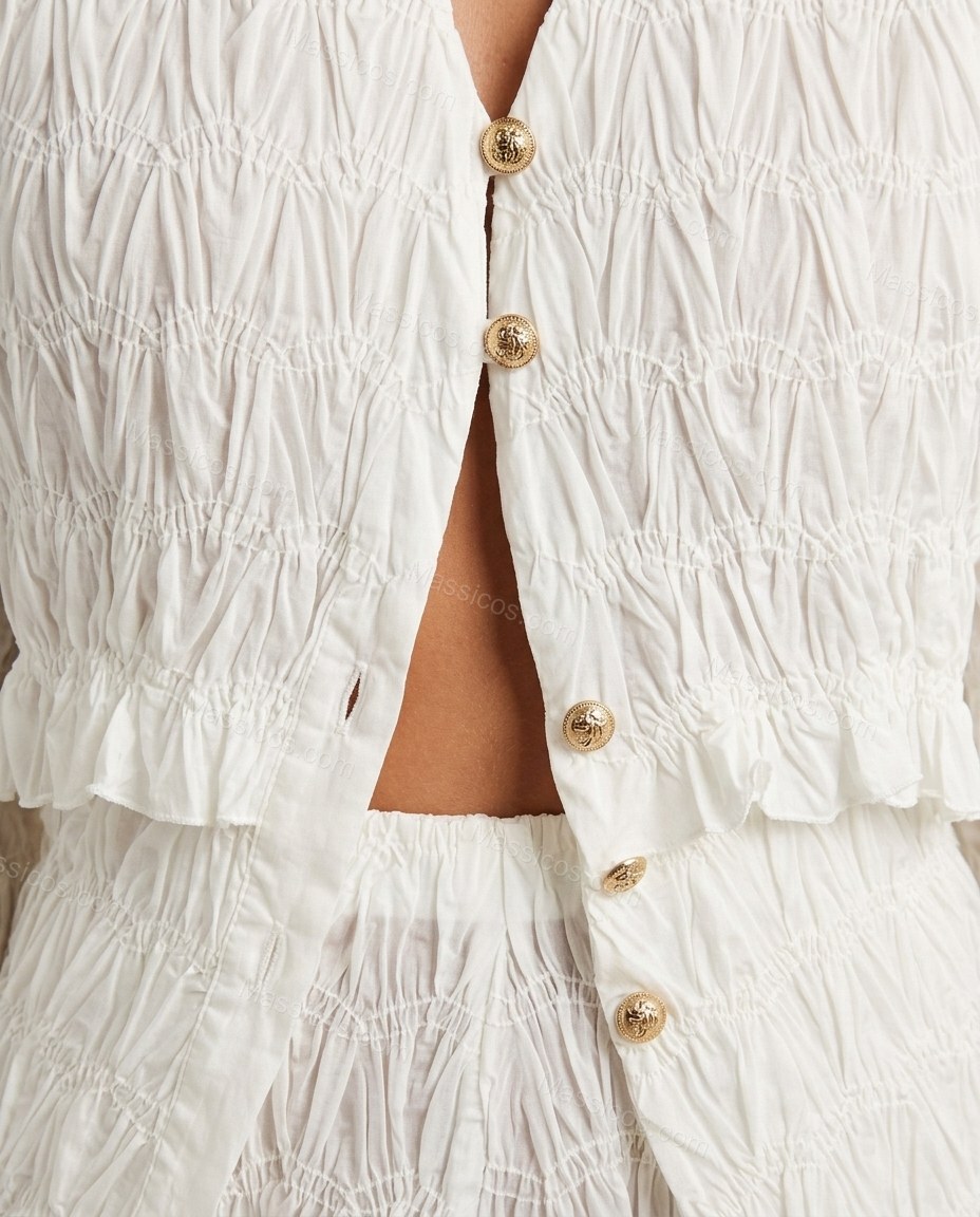 Off-white Peplum Pants Set, close-up of gold accents, front button closure and gold-tone buttons, by Massicos