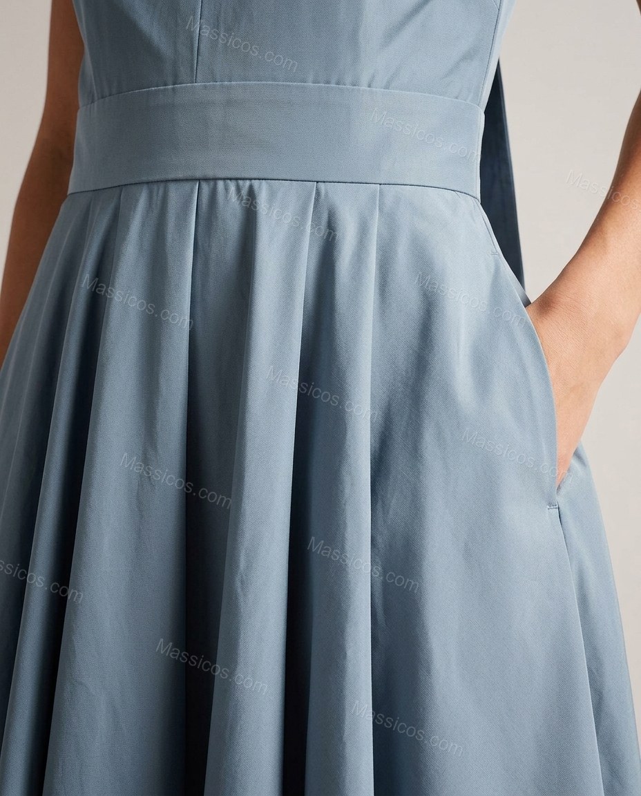 Dusty Blue Maxi Pleated Dress, close-up of side pockets, pleated skirt and twisted bodice detail, by Massicos
