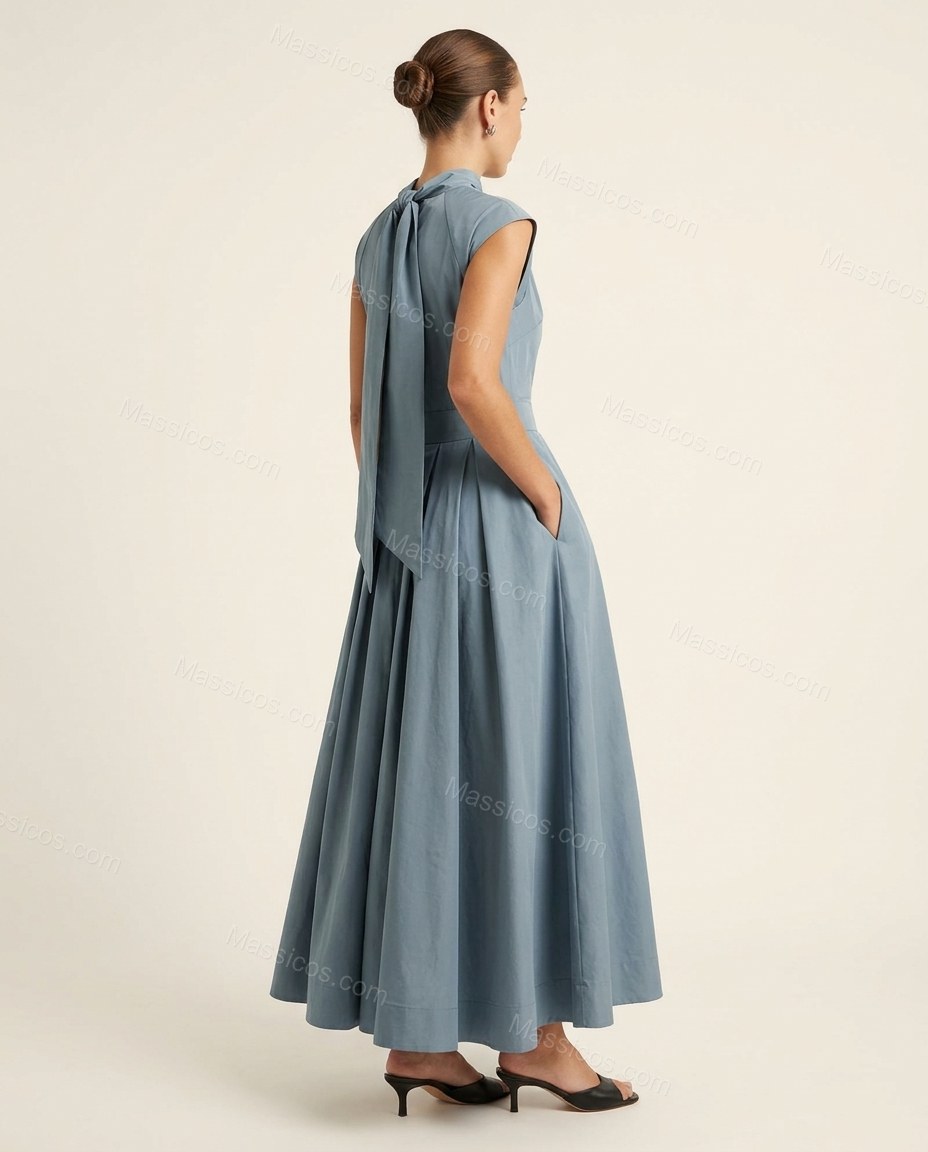 Dusty Blue Maxi Pleated Dress, back studio view showing high twisted neckline, long sash/tie from back waist, by Massicos