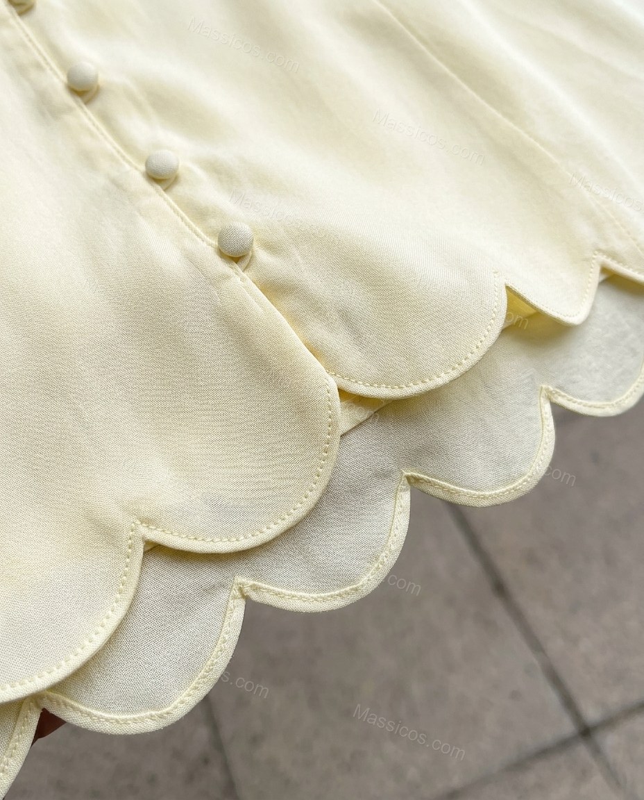 Pale Yellow Mini Pleated Dress, close-up of scalloped hem, by Massicos