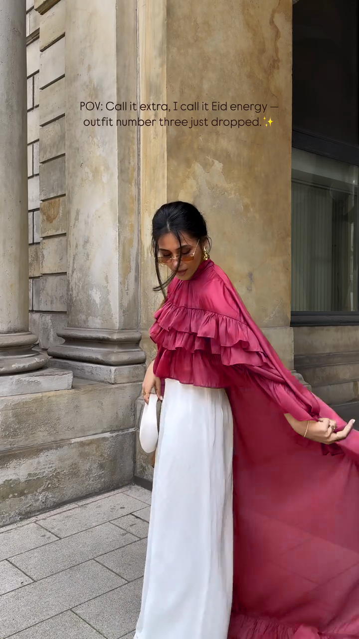 Ruffled cape-style top paired with wide-leg pants suit