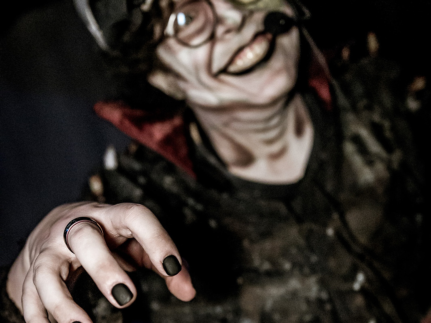 spooky halloween themed image of a man wearing the matte black press on nail set, which features a black nail base in a matte finish