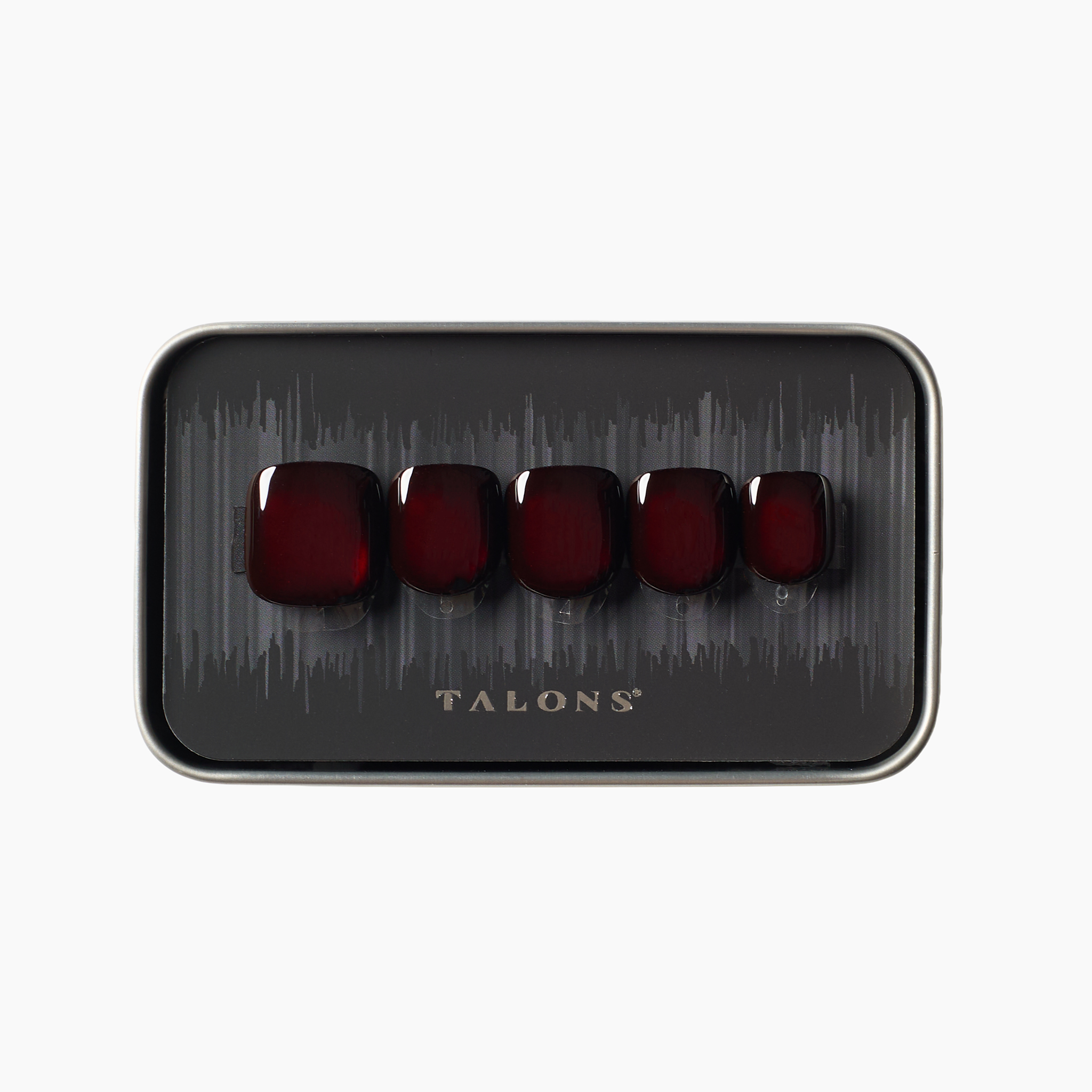 crimson press on nails with liquid metal gleam shown in packaging