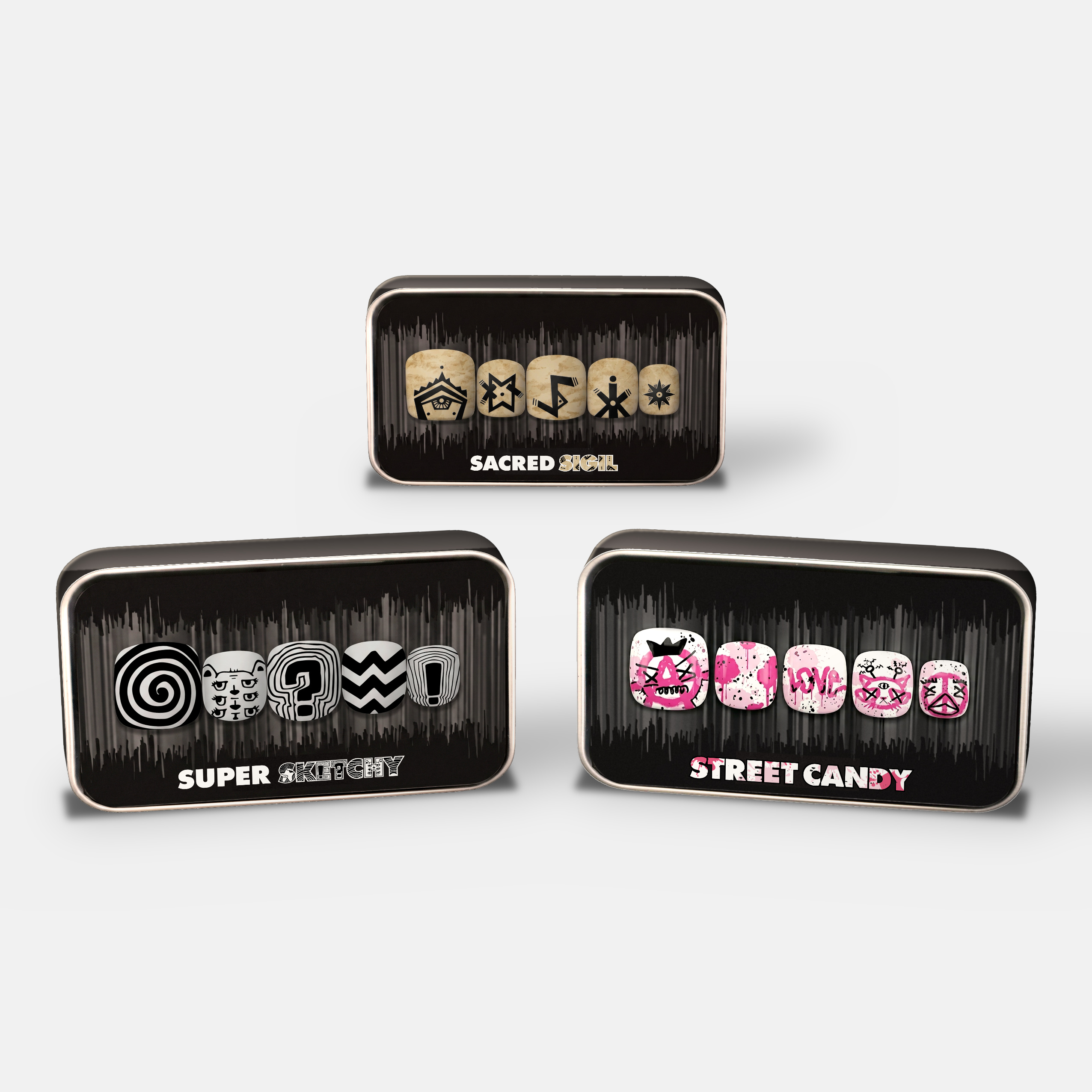 packaging image showcasing 3 press on nail sets, one with black and white graphics, one with a parchment colored background and black symbols, and one with a white background and black and bright pink graffiti print