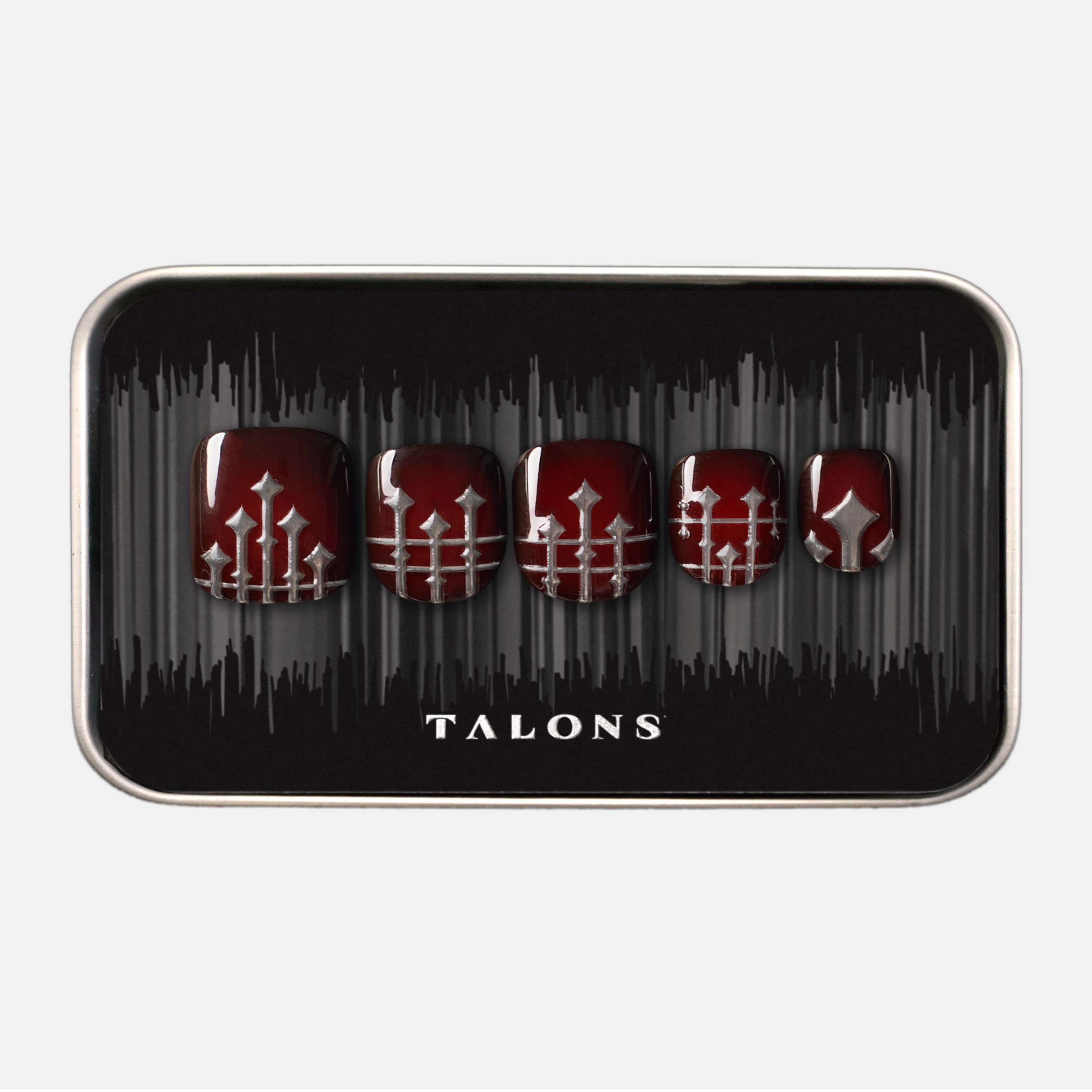 packaging image of press on nails kit with deep red cateye base and a 3D ornate silver ironwork design