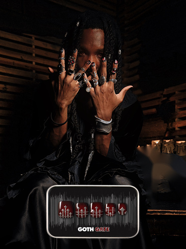 spooky Halloween themed image of a man wearing the Goth Gate press on nail set, which features a raised 3D iron gate design on top of a deep glossy red nail