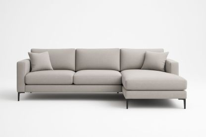 Divano angolare in tessuto grigio con cuscini
