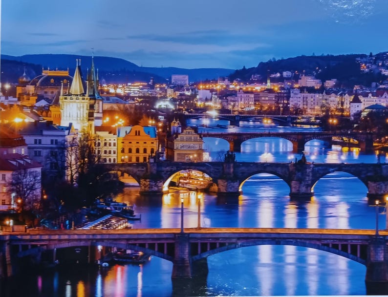 Prague Cityscape 1000-Piece Puzzle – Glowing River View, 27x21.5in