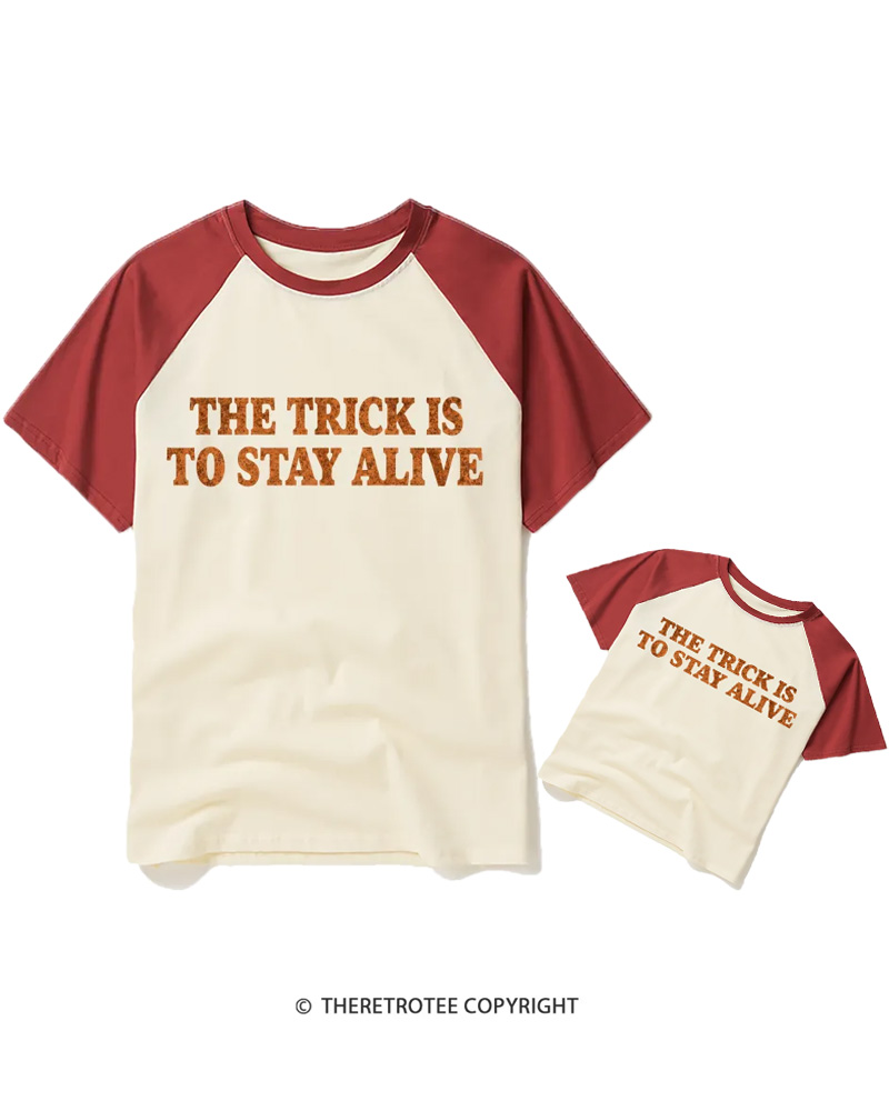 TheRetroTee The Trick Is To Stay Alive 1970s Halloween Raglan Baseball Family T-Shirt