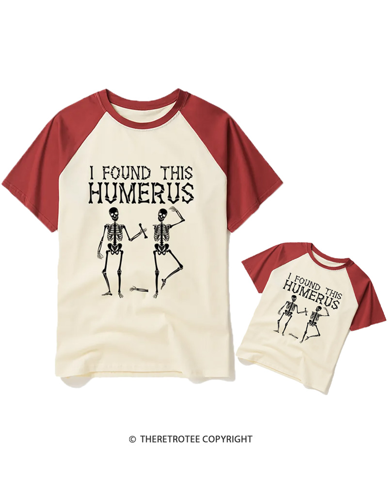 TheRetroTee I Found This Humerus 1980s Halloween Raglan Baseball Family T-Shirt