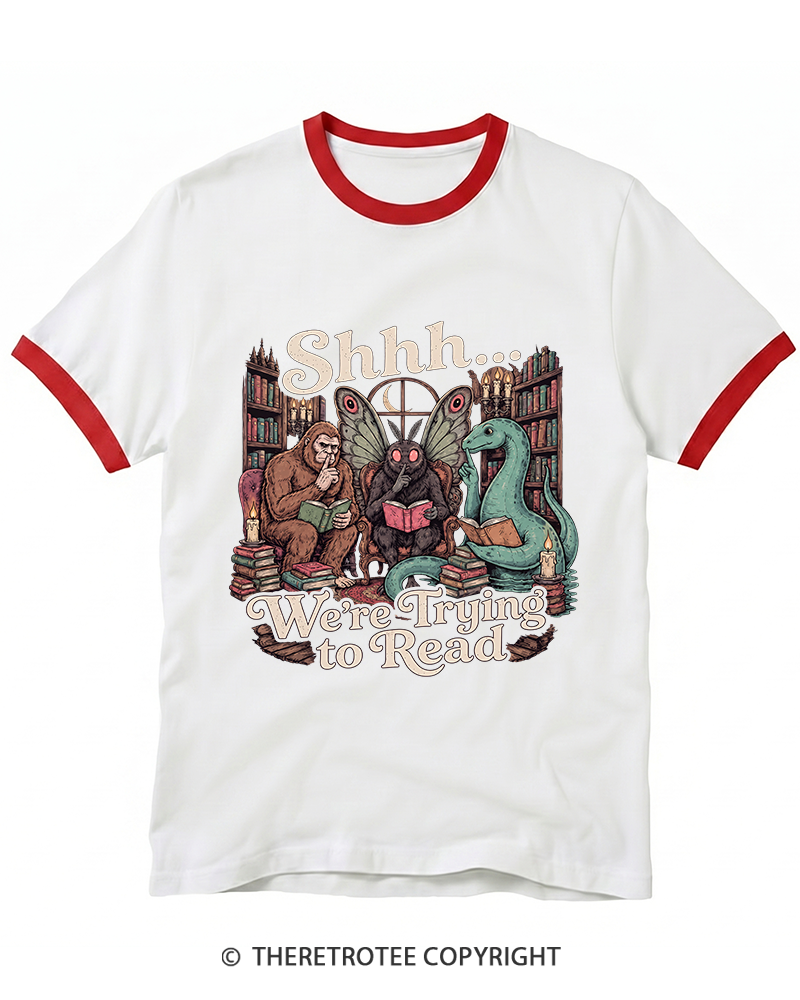 TheRetroTee Shhh We're Trying to Read Cryptid 1970s Ringer T-Shirt