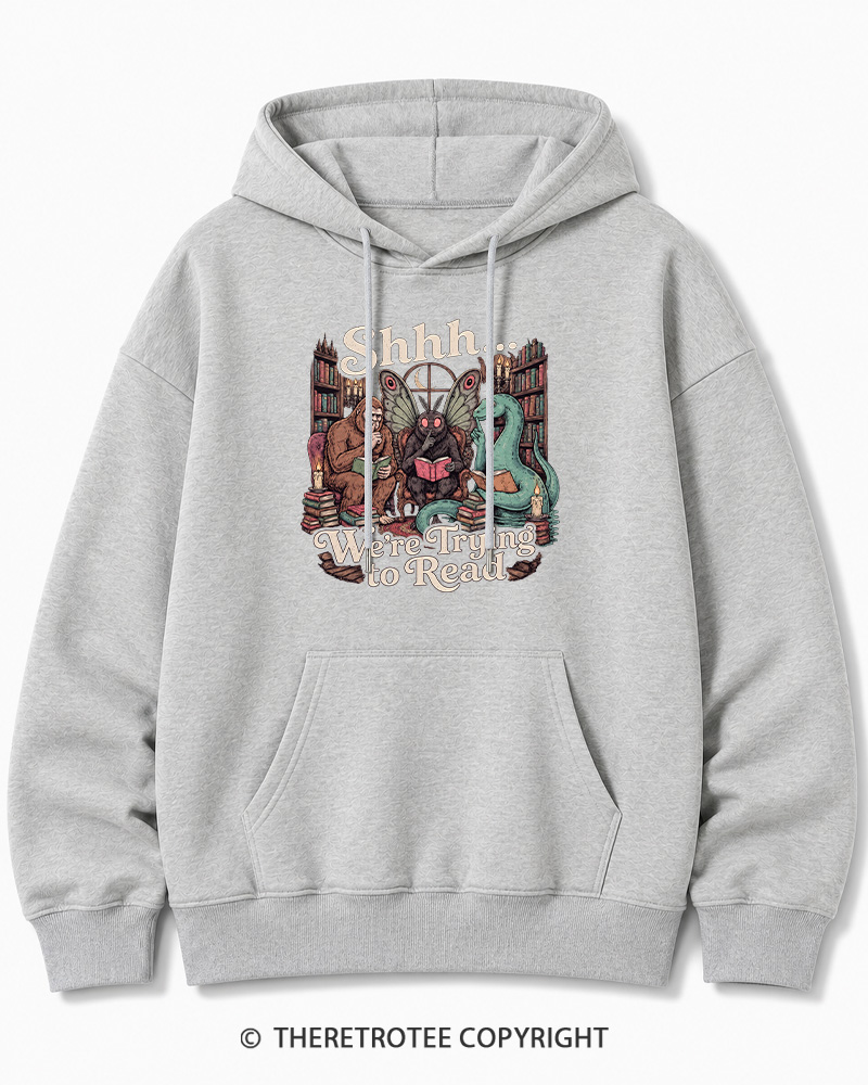 TheRetroTee Shhh We're Trying to Read Cryptid 1970s Halloween Cotton Hoodie