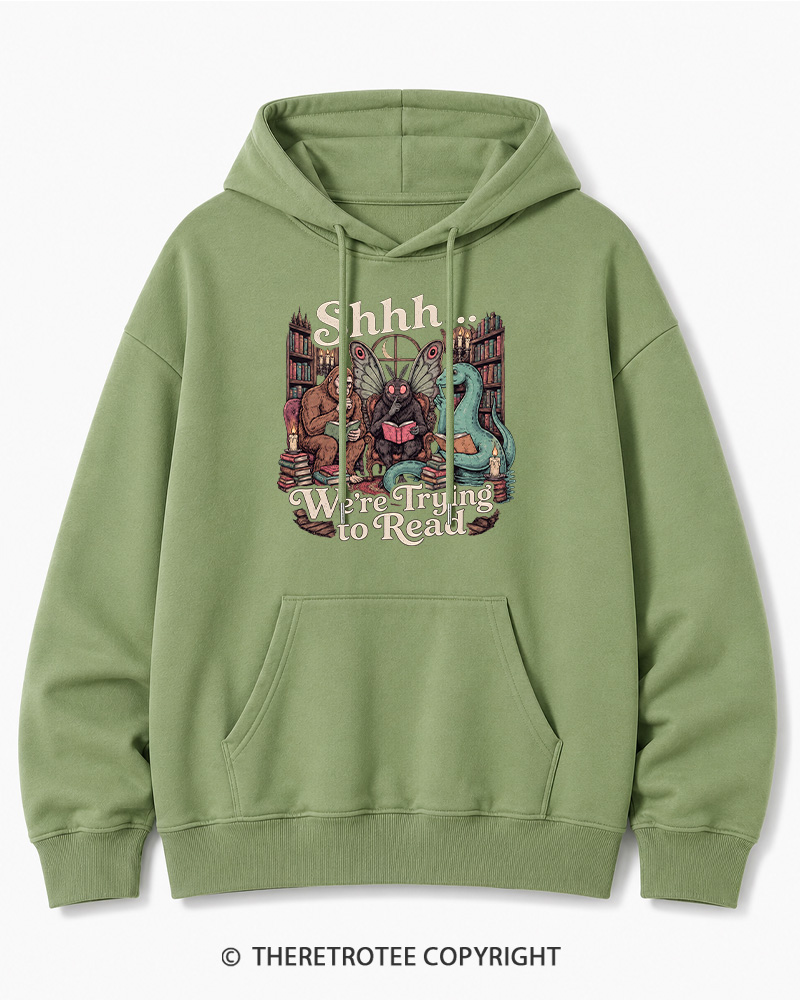 TheRetroTee Shhh We're Trying to Read Cryptid 1970s Halloween Cotton Hoodie