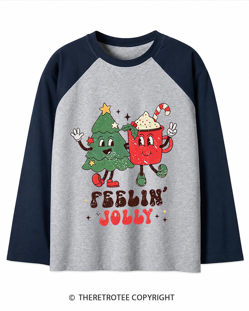 TheRetroTee Feelin’ Jolly 1970s Christmas Long Sleeve Raglan T-Shirt