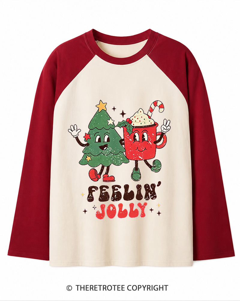 TheRetroTee Feelin’ Jolly 1970s Christmas Long Sleeve Raglan T-Shirt
