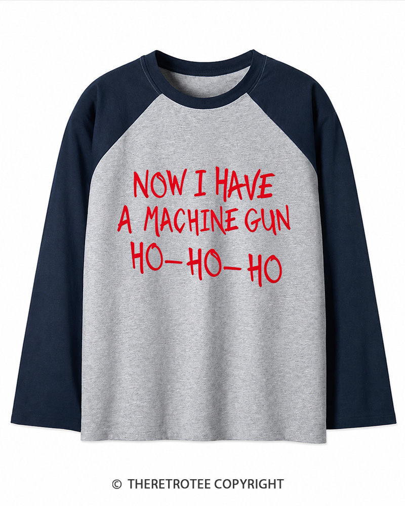 TheRetroTee Now I Have A Machine Gun Ho-Ho-Ho 1980s Christmas Long Sleeve Raglan T-Shirt