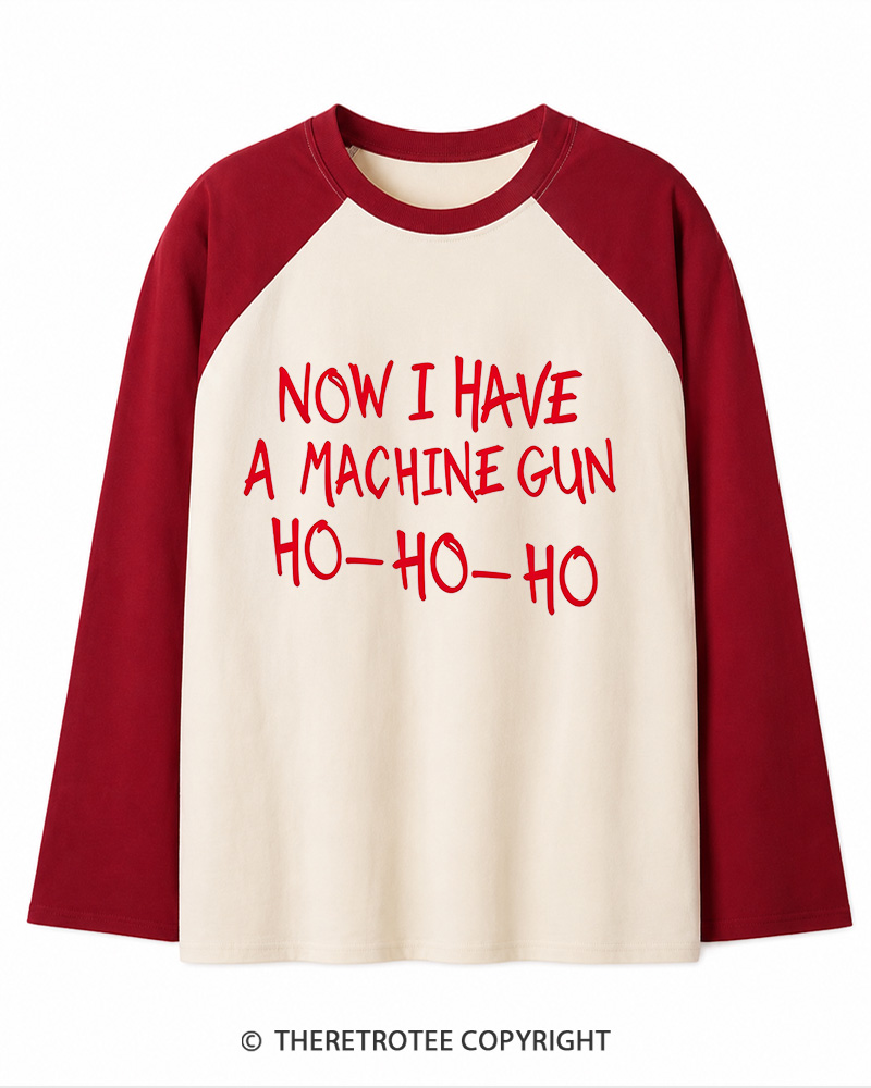 TheRetroTee Now I Have A Machine Gun Ho-Ho-Ho 1980s Christmas Long Sleeve Raglan T-Shirt