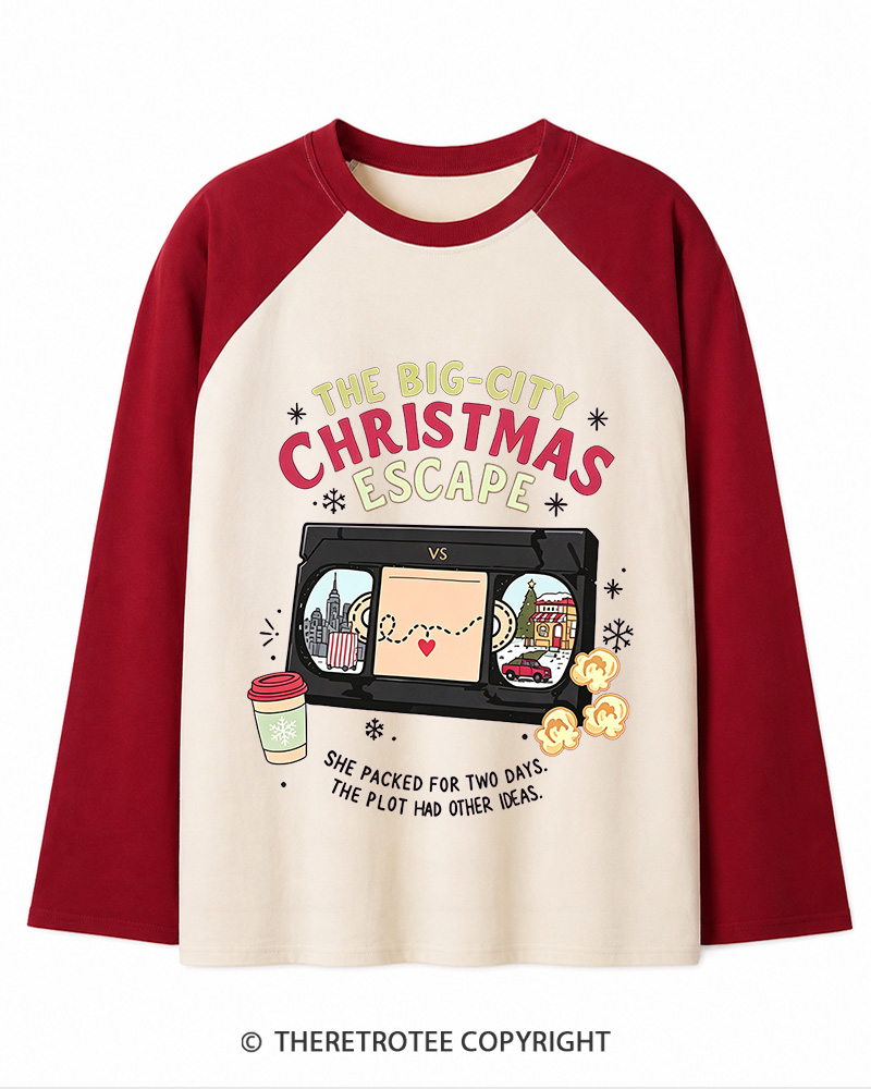 TheRetroTee The Big-City Christmas Escape 1990s Christmas Long Sleeve Raglan T-Shirt