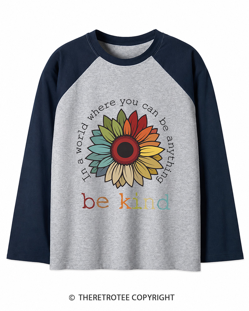TheRetroTee In A World Where You Can Be Anything 1970s Long Sleeve Raglan T-Shirt