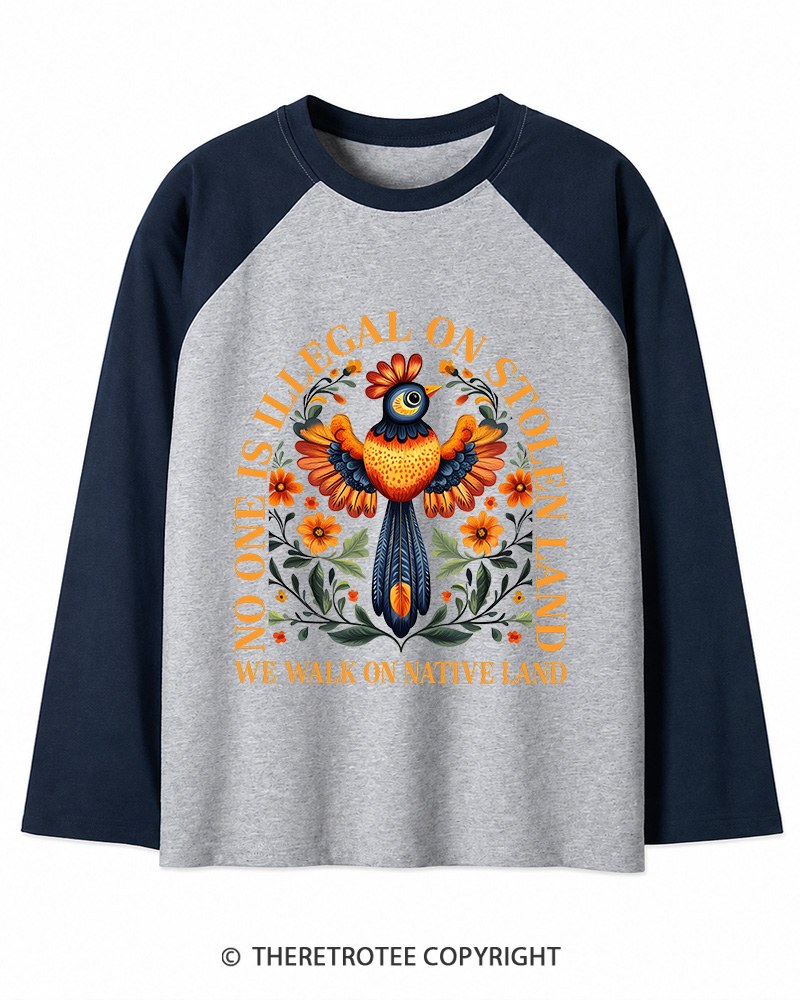 TheRetroTee No One Is Illegal On Stolen Land We Walk On Native Land Long Sleeve Raglan T-Shirt