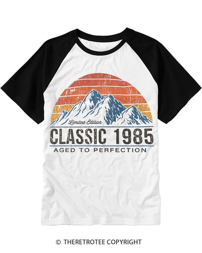 TheRetroTee 1985 Classic Mountain & Sunset Personalized Custom Year Raglan Baseball T-Shirt