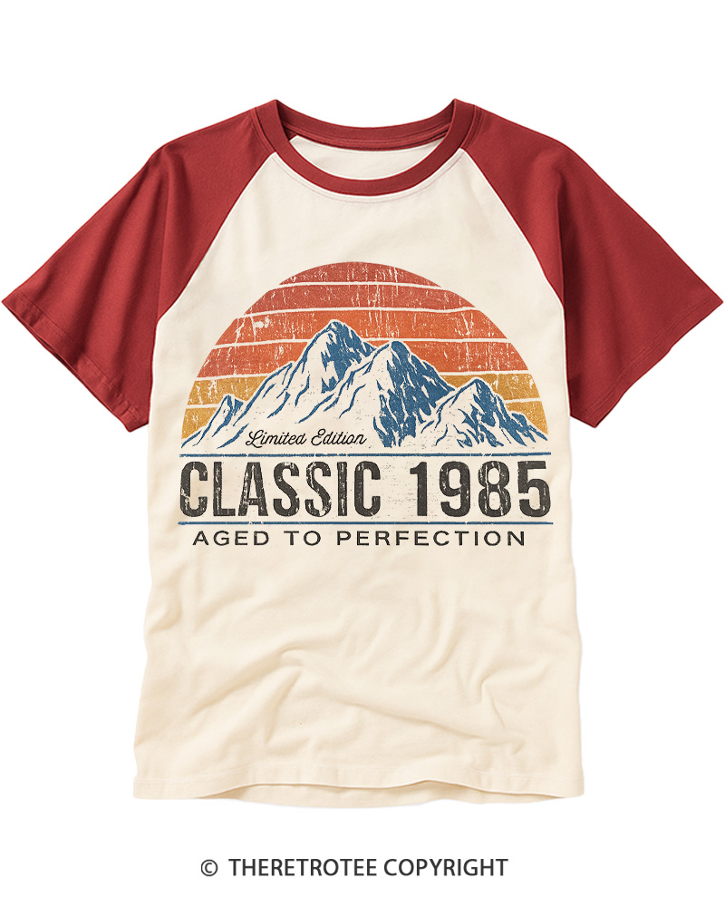 TheRetroTee 1985 Classic Mountain & Sunset Personalized Custom Year Raglan Baseball T-Shirt