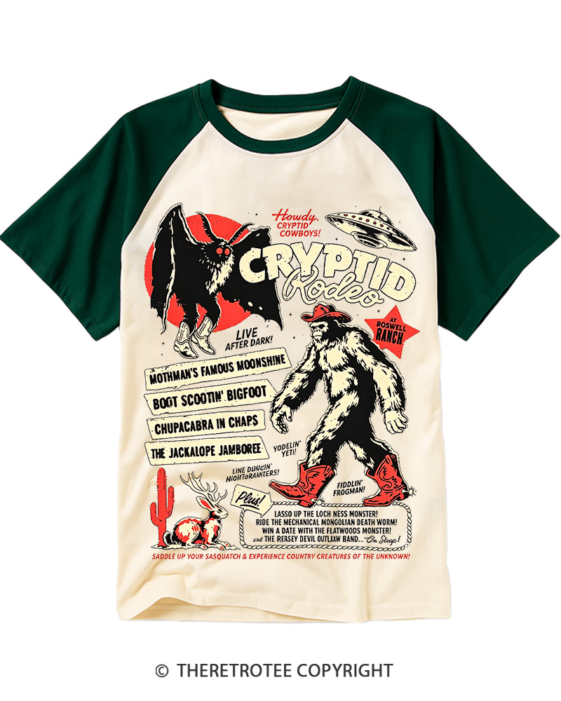 TheRetroTee Cryptid Rodeo Mothman Chupacabra Jackalope Cowboy 1970s Raglan Baseball T-Shirt