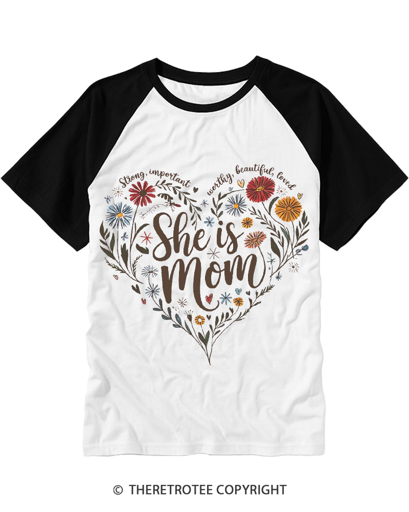 TheRetroTee She Is Mom Heart Floral Design 1970s Raglan Baseball T-Shirt